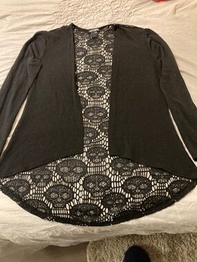 Used hot topic sweater lace back with skulls